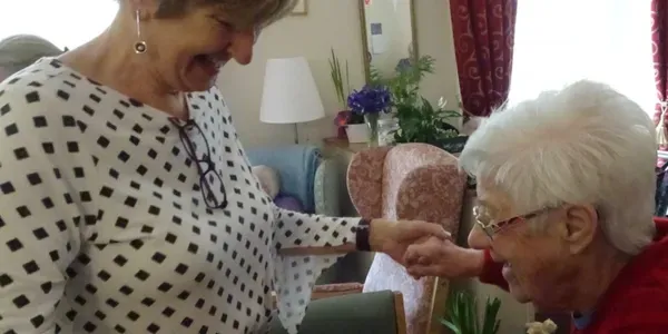 A carer sharing a moment with a resident