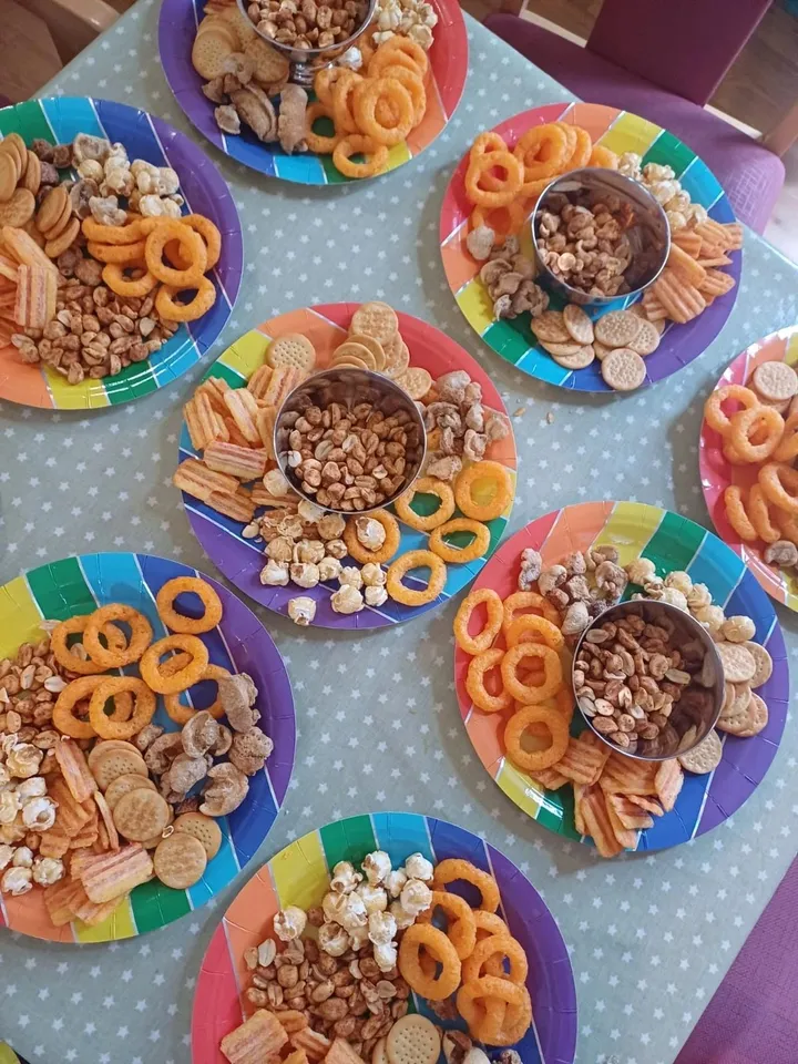 A table holding a large selection of savoury snacks