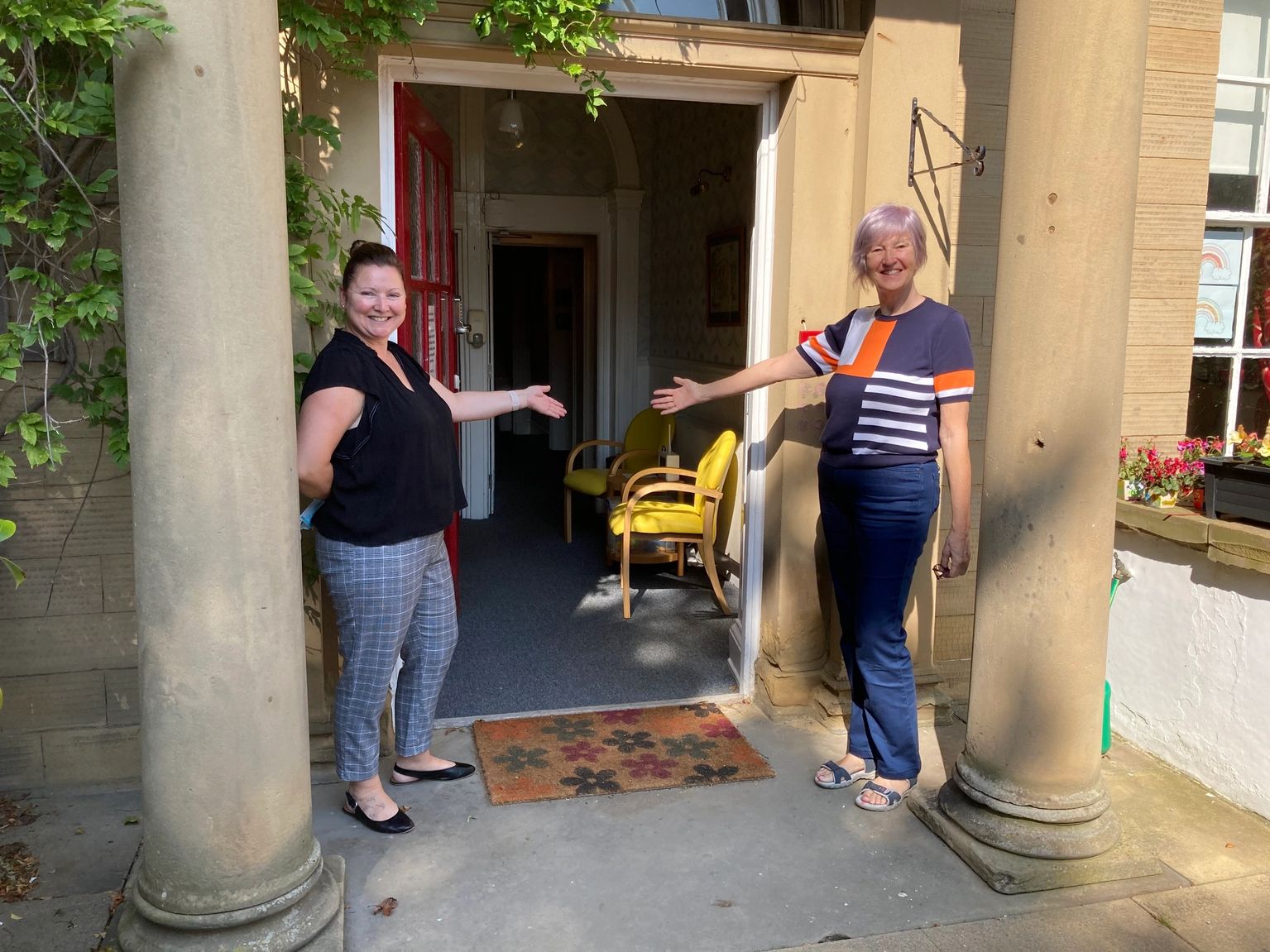 Sue and Lindsay welcoming visitors at the front door of Springfield House
